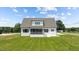 Expansive backyard featuring a screened porch, perfect for outdoor entertaining and relaxation at 321 Bud Wall Rd, Youngsville, NC 27596
