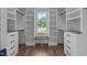 Walk-in closet with custom shelving and a window at 321 Bud Wall Rd, Youngsville, NC 27596