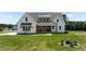 Inviting home with a charming front porch, a decorative awning, and well-maintained landscaping at 321 Bud Wall Rd, Youngsville, NC 27596