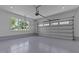 Spacious two-car garage with epoxy flooring, recessed lighting, and convenient automatic door at 321 Bud Wall Rd, Youngsville, NC 27596