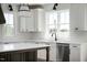 Stylish kitchen featuring modern appliances, quartz countertops, and custom cabinetry at 321 Bud Wall Rd, Youngsville, NC 27596