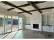 Spacious living area with a fireplace, built-in shelving, and hardwood floors at 321 Bud Wall Rd, Youngsville, NC 27596