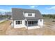 Aerial view of a bright modern home featuring a screened porch, generous yard, and appealing neighborhood surroundings at 321 Bud Wall Rd, Youngsville, NC 27596