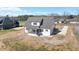 Aerial view of a bright modern home, showcasing a screened porch, large yard, and its pleasant neighborhood setting at 321 Bud Wall Rd, Youngsville, NC 27596