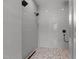 Tiled shower with dual shower heads and a mosaic tile floor at 321 Bud Wall Rd, Youngsville, NC 27596