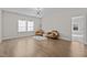 Bright sitting room with hardwood floors and two armchairs at 355 High Woods Rdg, Chapel Hill, NC 27517