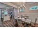 Cozy dining room adjacent to kitchen with modern lighting and views of the backyard at 364 Pecan Valley Way, Four Oaks, NC 27524