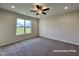 Bright bedroom with carpeted floors and large windows at 389 Springtooth Dr, Zebulon, NC 27597