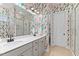 Modern bathroom with stylish wallpaper and double vanity at 413 Holding Creek Dr, Wake Forest, NC 27587