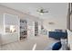 Well-lit bedroom with built-in shelving and a comfy couch at 413 Holding Creek Dr, Wake Forest, NC 27587