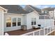 Relaxing deck with seating area and modern white railing at 413 Holding Creek Dr, Wake Forest, NC 27587