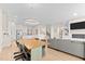 Bright dining room with wood table and modern light fixture at 413 Holding Creek Dr, Wake Forest, NC 27587