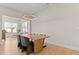 Dining area with wood table and view into living room at 413 Holding Creek Dr, Wake Forest, NC 27587