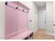 Inviting entryway with pink bench and coat hooks at 413 Holding Creek Dr, Wake Forest, NC 27587