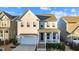 Two-story house with light beige siding, a white front door, and a brick walkway at 413 Holding Creek Dr, Wake Forest, NC 27587