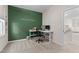 Bright home office features a standing desk, window, and green accent wall at 413 Holding Creek Dr, Wake Forest, NC 27587