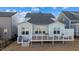 Rear view of house with deck and surrounding homes at 413 Holding Creek Dr, Wake Forest, NC 27587