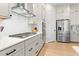 Modern kitchen with stainless steel appliances and white cabinets at 413 Holding Creek Dr, Wake Forest, NC 27587