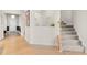 Light and airy carpeted stairwell with a half wall and neutral colored walls at 413 Holding Creek Dr, Wake Forest, NC 27587