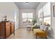 Bright sunroom with comfortable seating and plenty of natural light at 413 Holding Creek Dr, Wake Forest, NC 27587