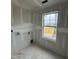 Room featuring drywall and a window overlooking the neighborhood at 46 Shortstop Cir, Four Oaks, NC 27524