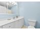 Bathroom with white vanity and light blue walls at 521 N Franklin Dr, Sanford, NC 27330