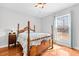 Bedroom with a wooden bed frame and hardwood floors at 521 N Franklin Dr, Sanford, NC 27330