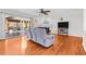 Bright living room with hardwood floors, fireplace, and sliding glass doors leading to deck at 521 N Franklin Dr, Sanford, NC 27330