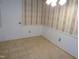 Small dining area with tiled floor and striped wallpaper at 626 Pine Ridge Pl Pl, Raleigh, NC 27609