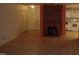 Living room with fireplace and view into kitchen at 626 Pine Ridge Pl Pl, Raleigh, NC 27609