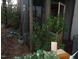 View of a back screened porch with surrounding greenery at 626 Pine Ridge Pl Pl, Raleigh, NC 27609