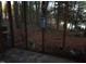 Screened porch overlooks a wooded area with a pond at 626 Pine Ridge Pl Pl, Raleigh, NC 27609