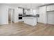 Spacious open-concept kitchen with a large island, stainless steel appliances, and hardwood floors at 708 Georgias Landing Pkwy # 14, Raleigh, NC 27603