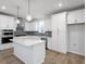 Modern kitchen featuring white cabinetry, stainless steel appliances, and a central island at 708 Georgias Landing Pkwy # 14, Raleigh, NC 27603