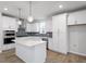 Modern kitchen featuring white cabinetry, stainless steel appliances, and a central island at 708 Georgias Landing Pkwy # 14, Raleigh, NC 27603