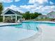 Community pool with lounge chairs and umbrellas available for residents to enjoy at 708 Georgias Landing Pkwy # 14, Raleigh, NC 27603