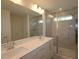 Bathroom boasts double sinks, a large mirror, and a sleek glass shower enclosure at 7113 Hubner Pl # 20, Cary, NC 27519