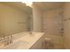 Bathroom featuring double sink vanity, large mirror, white bathtub, and matching toilet at 7113 Hubner Pl # 20, Cary, NC 27519