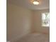 A view of a bedroom featuring a window providing natural light with unfinished flooring at 7113 Hubner Pl # 20, Cary, NC 27519