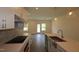 Kitchen featuring stainless steel appliances, island, and modern finishes at 7113 Hubner Pl # 20, Cary, NC 27519