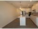 Modern kitchen featuring stainless steel appliances and a kitchen island at 7113 Hubner Pl # 20, Cary, NC 27519