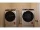 Modern laundry room showcasing a new washer and dryer with a shelf for storage at 7113 Hubner Pl # 20, Cary, NC 27519