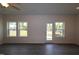Bright living room with wood-look flooring and multiple windows for natural light at 7113 Hubner Pl # 20, Cary, NC 27519