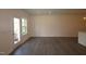 Bright, airy living room features modern flooring and a door leading to the outdoor space at 7113 Hubner Pl # 20, Cary, NC 27519