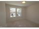 Small room with a double window offers natural light and neighborhood views at 7113 Hubner Pl # 20, Cary, NC 27519
