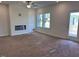 Bright living room with a fireplace and windows letting in plenty of natural light at 7115 Hubner Pl # 21, Cary, NC 27519