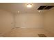 Unfinished basement space with multiple doors, lighting and unfinished floor at 7117 Hubner Pl # 22, Cary, NC 27519
