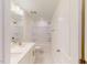 Clean, white bathroom with tub, shower, double vanity, and tile floors at 7117 Hubner Pl # 22, Cary, NC 27519
