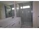 Modern bathroom with glass shower, tile, and vanity with white countertop at 7117 Hubner Pl # 22, Cary, NC 27519