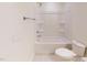 Bright white bathroom features a tub and shower combination; perfect for relaxation at 7117 Hubner Pl # 22, Cary, NC 27519